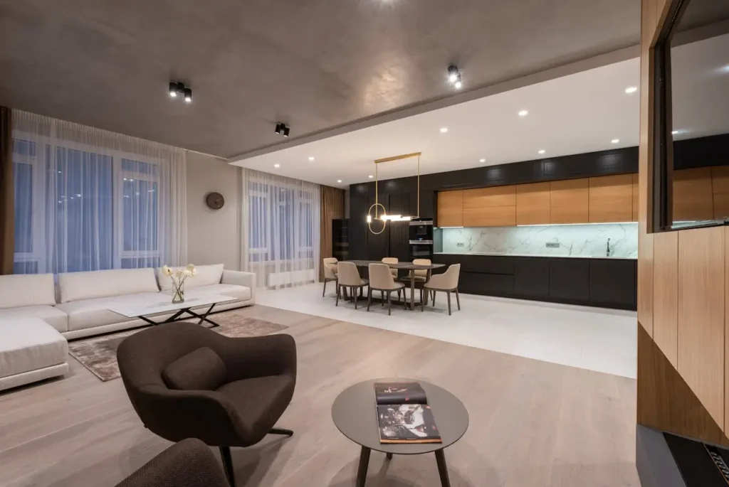 A focused image of a seamless, under-cabinet LED light strip in a minimalist kitchen